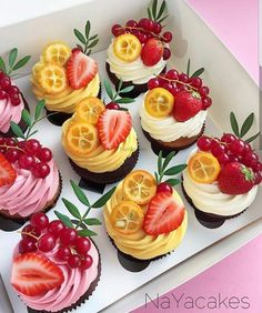 there are many cupcakes with fruit on them