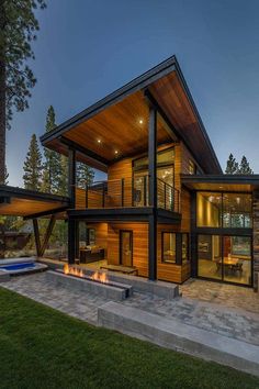 a modern house with an outdoor fire pit