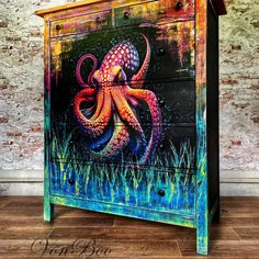 an octopus painted on the side of a dresser