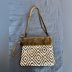 This Is A New But With Out Tags Bag, It Was A Gift I Took Tags Off And Then Never Used. Handmade *Handmade From Genuine Leather, Upcycled Rug, And Canvas *This Bag Is A Beautifully Sewn With A White Tan, Black, And Gray Pattern *12"W *10"H *6.5" Wrist Handle *23" Adjustable/Detachable Leather Shoulder Strap *Lined Interior With One Zipper Pocket And Two Slip Pockets Grey Pattern, Small Crossbody Bag, Small Crossbody, Black And Gray, Bago, Zipper Pocket, Crossbody Bag, Shoulder Strap, Genuine Leather