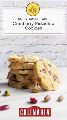 some cookies are stacked on top of each other with the words nutty sweet tart cranberry pistachio cookies