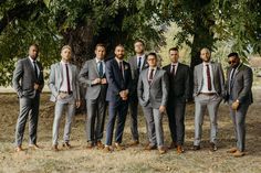 a group of men in suits standing next to each other