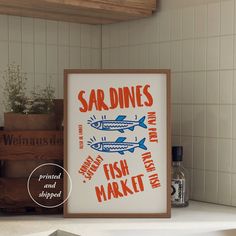 a fish market sign is displayed in front of a shelf with spices and other items