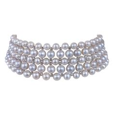 This beautiful choker features high luster White Pearls which display a wonderful sheen, all woven together into a beautiful design. Faceted, White Gold Plated Silver beads are woven between Pearls, adorning this necklace with a great and dramatic Shine when hit with light. This Choker is woven with a slight graduation to curve naturally with the neck, allowing it to be worn comfortably and snug. Measuring 13.25 inches long, this piece meets at a Decorative White Gold Plated - Silver Sliding Clasp, which perfectly matches the shine and polish of the beads. Woven Choker, Beautiful Chokers, Akoya Pearls, Pearl Choker, Gold Plated Silver, Faceted Bead, Silver Beads, Pearl Jewelry, Pearl White