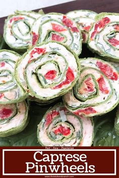 spinach pinwheels with cream cheese and strawberries on top are ready to be eaten