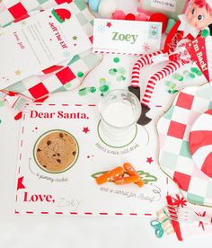 a table topped with cookies, candy and other holiday items on top of a white surface