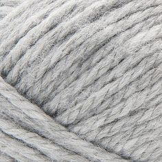 a ball of yarn is shown in light grays and white colors, as if for knitting or crocheting