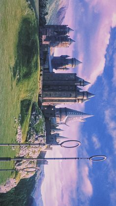 an image of a castle in the sky with clouds reflected on it's surface