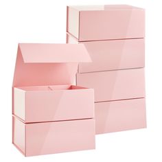 three pink boxes stacked on top of each other with one open and the other closed