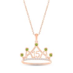 In your eyes, she's a princess. Show her how special she is on her Quinceañera with this gorgeous crown necklace emblazoned with the number 15. Bright green peridots – the birthstone of August – gleam in bezel settings on the points of the regal 10K rose gold crown. White lab-created sapphire accents add eye-catching sparkle. The pendant sways from an 18-inch cable chain that secures with a spring ring clasp. Elegant Crown Design Jewelry For Birthdays, Elegant Crown Design Jewelry For Birthday, Rose Gold May Birthstone Necklace For Birthday, Princess Crown Jewelry For Anniversary, Rose Gold Crown, Number 15, Crown Necklace, White Lab, Gold Crown