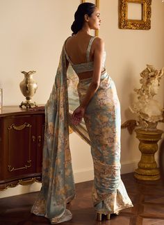 Dusty Mint Floral Printed Saree – Lashkaraa Transitional Designer Silk Palazzo Set, Tissue Silk Palazzo Set With Zari Work, Festive Tissue Silk Palazzo Set, Bollywood Style Silk Palazzo Set For Navratri, Navratri Silk Palazzo Set With Traditional Drape, Elegant Brocade Pre-draped Saree For Designer Wear, Semi-stitched Silk Palazzo Set For Navratri, Navratri Semi-stitched Silk Palazzo Set, Eid Wedding Choli With Printed Motifs