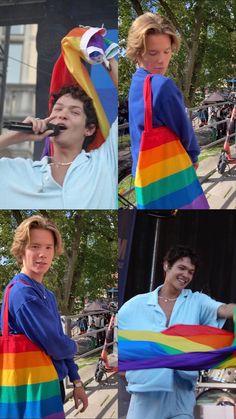 a woman in a rainbow colored dress singing into a microphone and holding onto a man's neck