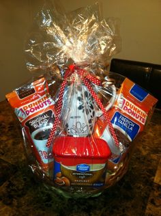 a basket filled with coffee and snacks on top of a table