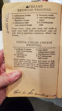 an old recipe book is open to show information about creamy brownie frosting