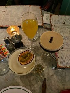 a table topped with plates and glasses filled with food