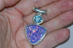 "IMPORTANT...CLICK ON ( + MORE) BELOW TO SEE ALL SPECS & DETAILS JEWELRY STORE RETAIL....$677.00 MODERN GLOWING DICHROIC GLASS 925 PENDANT....Hand crafted one of a kind natural topaz & glowing trillion glass. The glass is thick & colorful fire filled pinks, reds & blues that would make an Australian black opal jealous. A VERY solid well crafted pendant, hallmarked 925 BACK ** IMPORTANT...SCROLL DOWN PAST LINKS BELOW FOR MORE DETAILS NOTE: CURRENTLY IN STOCK FOR IMMEDIATE SHIPPING Colorful Fire, Australian Black Opal, Art Deco Pendant, Detailed Jewelry, Modern Art Deco, Silver Art, Dichroic Glass, Black Opal, Jewelry Store