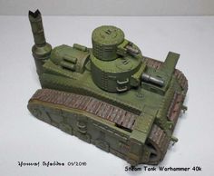 a small toy tank sitting on top of a table