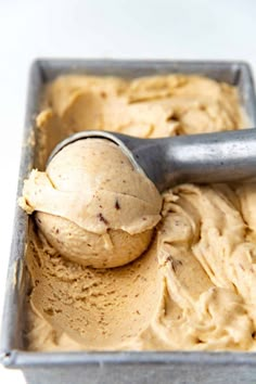 a scoop of ice cream in a metal container