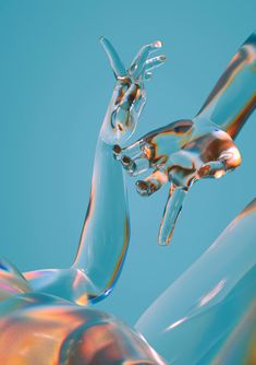 an abstract image of two animals made out of liquid or glass on a blue background