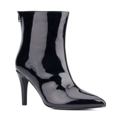 Crafted from ultra-shiny vegan patent leather, this beautiful pair of boots is perfect for any special occasion. The classic pointy toe heel is complemented by the modern back zipper closure, providing utmost convenience without compromising style. And thanks to its generous width, your feet will stay comfortable all night long. A stunning statement boot with attitude! Sleek Glossy Boots For Evening, Sleek Glossy Finish Evening Boots, Chic Glossy Finish Boots For Parties, Elegant Formal Boots With Glossy Finish, Elegant Glossy Finish Boots For Formal Occasions, Elegant Glossy Finish Formal Boots, Glossy Party Boots, Elegant Glossy Evening Boots, Sleek Patent Leather Boots For Formal Occasions