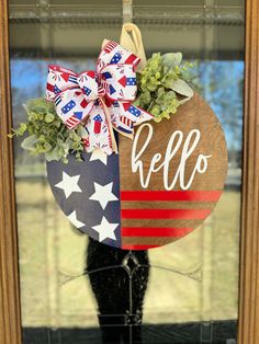 a door hanger decorated with an american flag and the word hello