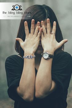 a woman covering her face with both hands