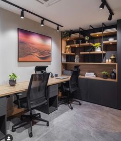 an office with black chairs and wooden desks