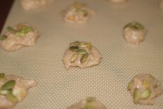 pistachios are on a baking sheet and ready to go into the oven