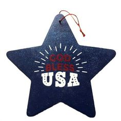 a blue star ornament with the words god bless usa on it