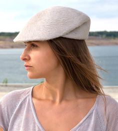 „Lou" is a light cap with a refined fold. They are available in a delicate pastel tint, in the quality Melousine. Available in sizes 55 cm - 58 cm Colour: „silk" Cap from Melousine Ribbed belt made of 66% cotton and 34% polyamide Handmade designer fashion. Individualization options Other colors or sizes on request All hats are made by hand and it takes time for a perfect hat. All hats are ready 7-12 days after payment received. Please determine your hat size as follows: Head circumference in cm: Chic Spring Fur Felt Hat, Spring Fitted Fur Felt Hats, Elegant White Fur Felt Hat, Elegant White Flat Cap, Elegant Beige Flat Cap, Fedora Outfit, Women's Caps, Rock N Roll Style, Felt Hats