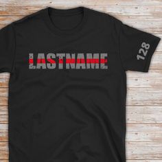 a black t - shirt with the word, last name on it