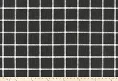 black and white checkered fabric with grey lines on the side, as well as a ruler