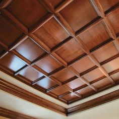 a ceiling with wooden paneling in an empty room