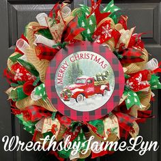 a christmas wreath with a red truck on it