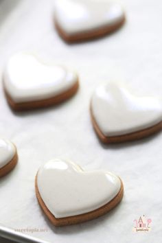 heart shaped cookies on a baking sheet ready to be baked