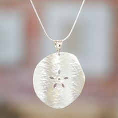 Working in Mexico's legendary Taxco silver, Guillermo Arregui depicts a sand dollar. The petite sea creatures sometimes wash ashore on sandy beaches. He displays the subtly-textured pendant on a sterling silver chain necklace. Sand Dollar Necklace, Sterling Silver Chain Necklace, Sand Dollar, Sterling Silver Necklace Pendants, Sandy Beaches, Silver Chain Necklace, Silver Pendant Necklace, Sterling Silver Chain, Sea Creatures