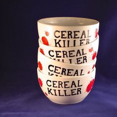 three white bowls with red and black designs on them, one has the words cereal killer written on it