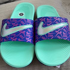 Nwt Nike Slippers/Slides Color: Purple/Green Unisex Size:4y Soft And Comfortable Fit Nike Non-slip Slides, Playful Non-slip Slip-on Slides, Playful Non-slip Synthetic Slides, Non-slip Synthetic Fun Slides, Fun Non-slip Synthetic Slides, Nike Slip-on Slides For Swimming, Nike Non-slip Slip-on Slides, Nike Non-slip Flat Slides, Playful Synthetic Slip-on Slides