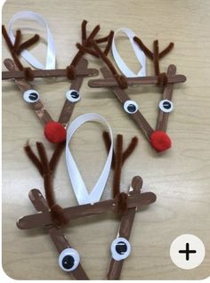 reindeer craft for kids to make with paper strips and glue on the nose, eyeballs and ribbon