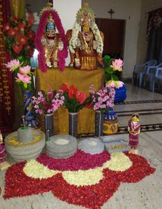 there is a shrine with flowers on the floor