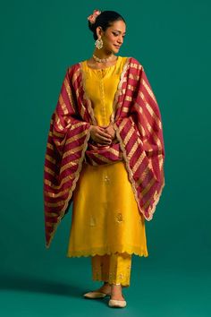 Yellow silk chanderi kurta with sequins, cutdana and resham hand embroidery. Comes with pant and a wine chanderi dupatta. Components: 3 Pattern: Hand embroidered Type Of Work: Sequins, Cutdana, Resham Neckline: Notched Sleeve Type: Full Fabric: Silk chanderi, Dupatta: Chanderi Color: Yellow Other Details:  Model Height: 5ft 6inches, wearing size S Occasion: Sangeet - Aza Fashions Chanderi Kurta Designs, Yellow Kurta, Chanderi Dupatta, Kurta Pant Set, Kurta Set For Women, Yellow Silk, Straight Kurta, Women Kurta, Kurta With Pants