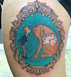 a man with a clock tattoo on his thigh