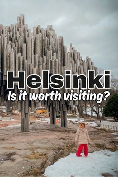 a person standing in front of a giant sculpture with the words helsinki is it worth visiting?