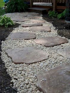 a walkway made out of rocks and gravel