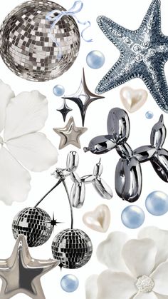 an assortment of silver and white objects are arranged in the shape of balls, stars, and flowers