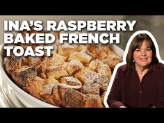 a woman standing in front of a pan filled with baked french toast