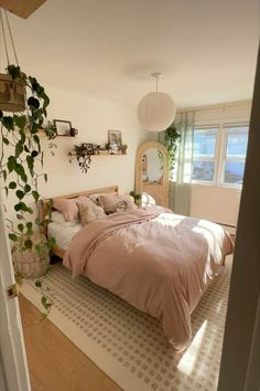 a bed sitting in a bedroom next to a window with plants growing on the wall