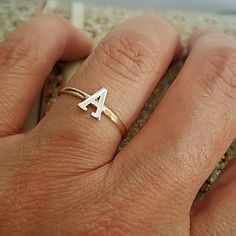 14k Yellow Gold Band With White Gold Initial "A" Band Ring. Available In Sizes 3 4 5 6 7 8 9 Item#Rg2345-1-30. Dainty White Gold Initial Ring Stamped 14k, Adjustable White Initial Ring For Anniversary, Dainty Sterling Silver Initial Ring Stamped 14k, White Initial Ring Fine Jewelry For Gift, Fine Jewelry Initial Ring With Diamond Cut As Gift, Stackable Initial Ring In Yellow Gold And Sterling Silver, Yellow Gold Stackable Initial Ring In Sterling Silver, Fine Jewelry Diamond Cut Initial Ring As Gift, Stackable Sterling Silver Initial Ring In Yellow Gold