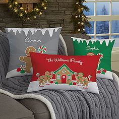 three christmas pillows sitting on top of a couch