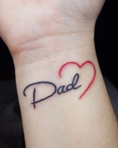 a small wrist tattoo with the word dad written on it